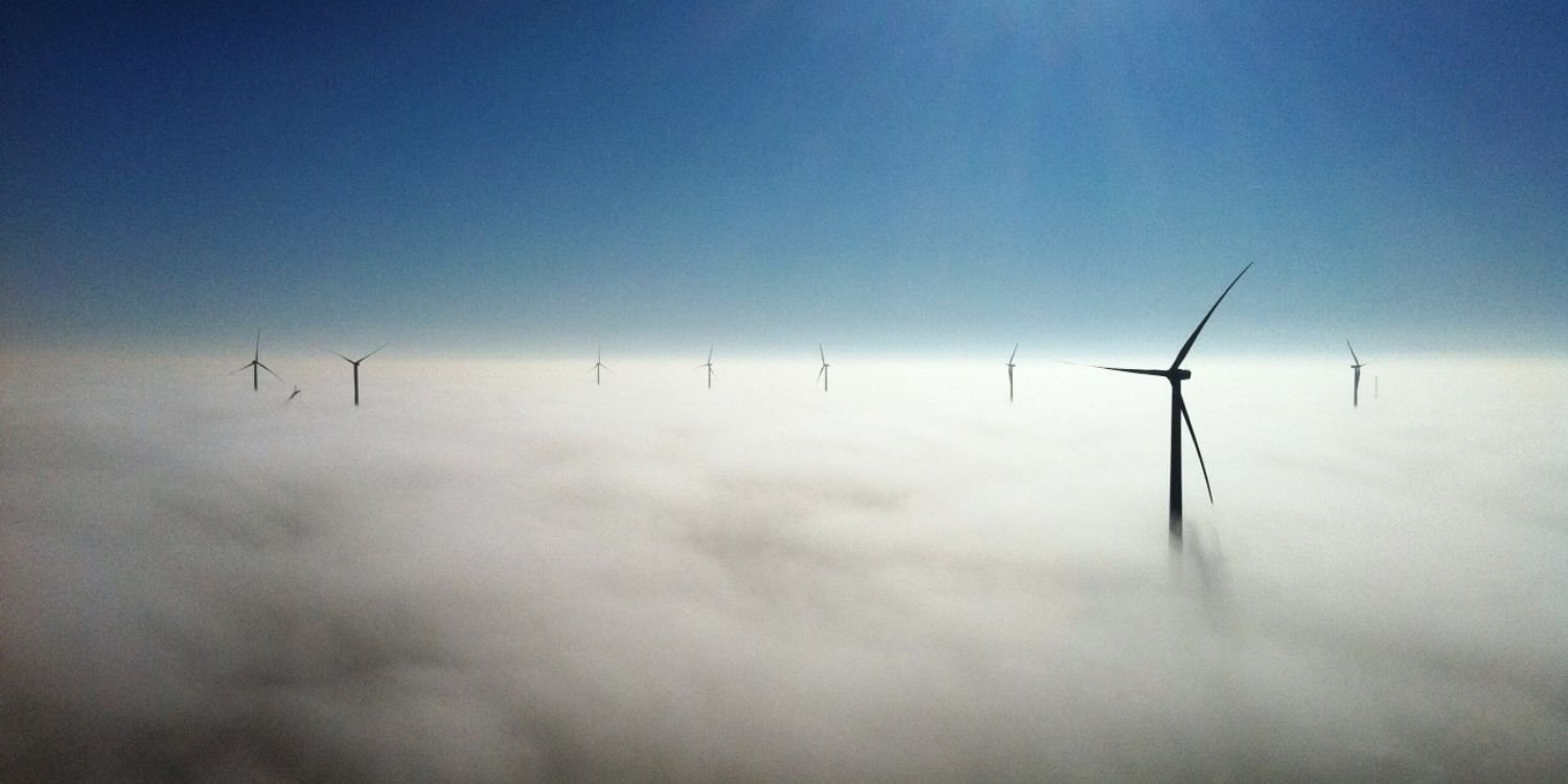 wind turbines through clouds